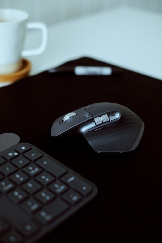 Stylish office setup highlighting a wireless mouse and keyboard on a desk.